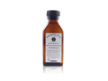 A small amber glass bottle of Beardsman Oil Co. after shave with a black ribbed cap and a white label, centered on a white background with a faint reflection below.