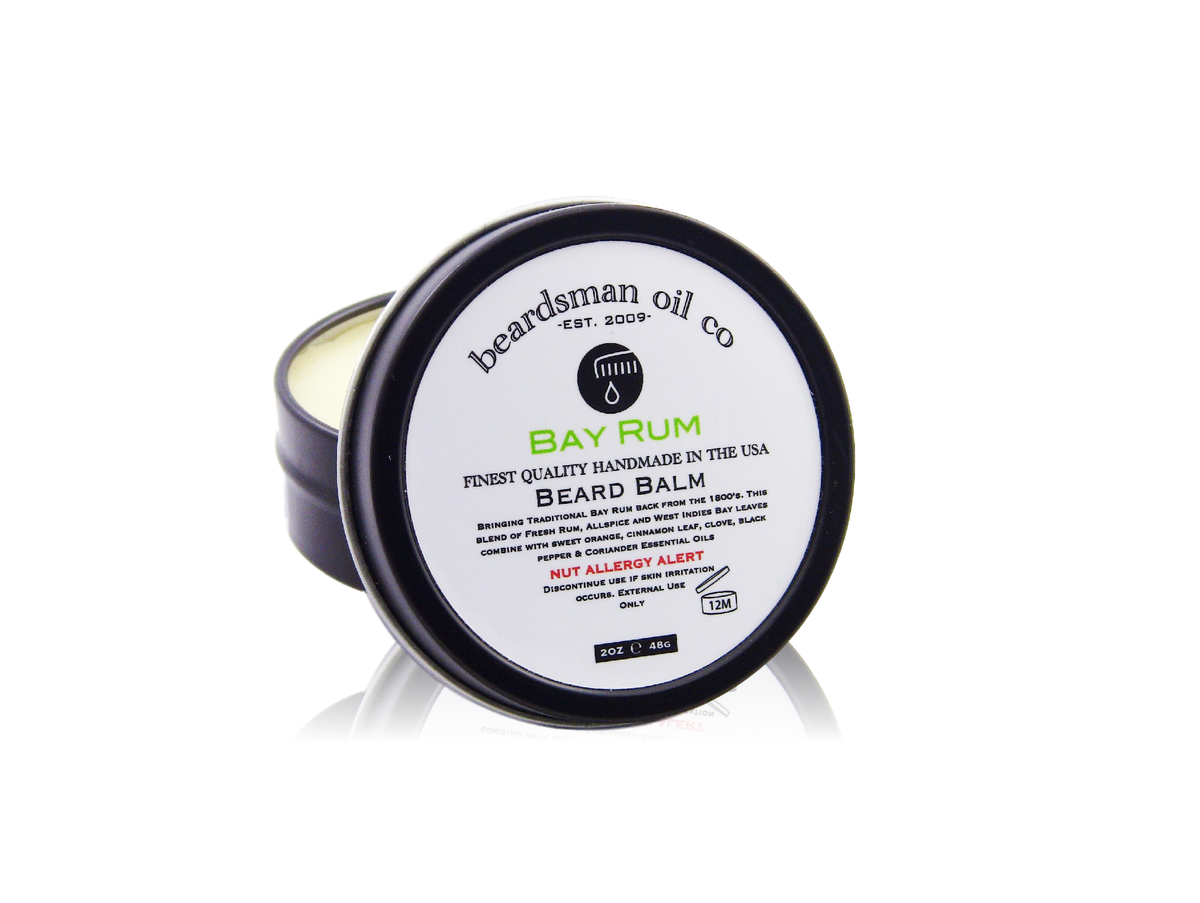 Open black tin of Beardsman Oil Co Bay Rum beard balm with white label, with reflection shown under

