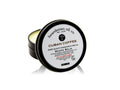 Open black tin of Beardsman Oil Co Cuban Coffee beard balm with white label
