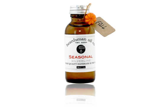 Amber glass bottle of Beardsman Oil Co limited-edition Fall seasonal beard oil with silver cap, white label, and hang tag.