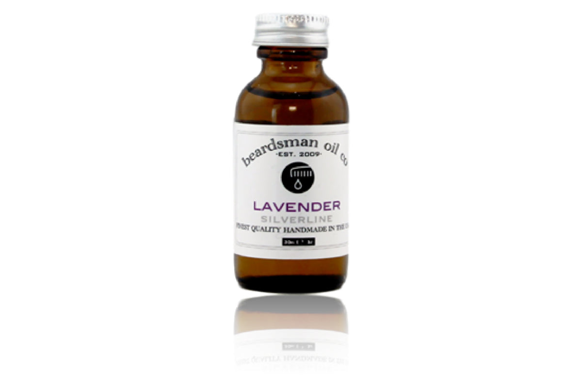 Amber glass bottle of Beardsman Oil Co Lavender beard oil with silver cap and white label.