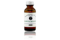 Amber glass bottle of Beardsman Oil Co North Woods beard oil with silver cap and white label.
